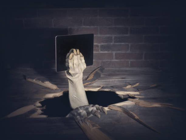 istock Zombie hand through hole cracked in rustic wood.Halloween theme 1038691562