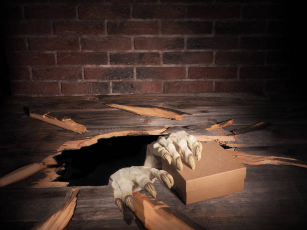 istock Zombie hand through hole cracked in rustic wood.Halloween theme 1038691786