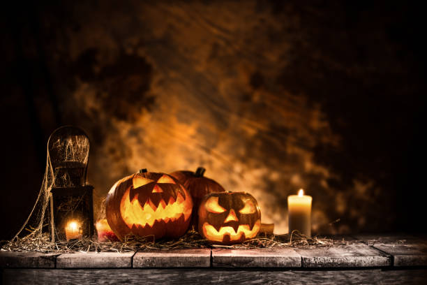 istock Halloween pumpkins on wooden planks. 1038692362