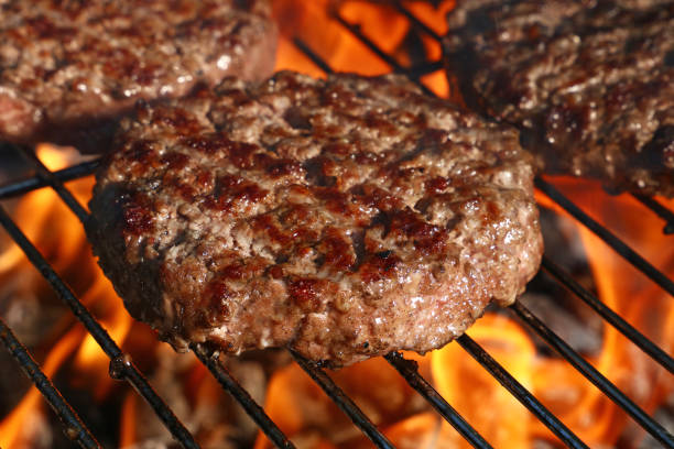 istock Beef burger for hamburger on barbecue flame grill 1038695142