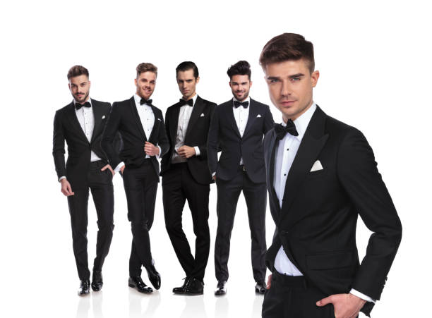 istock groomsman leader standing in front with hands in pockets 1038703454