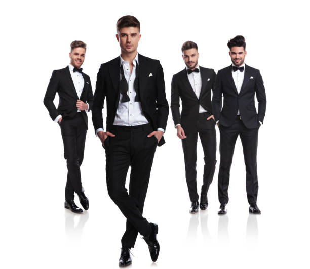 istock group of four men in tuxedos, one having open collar 1038703486