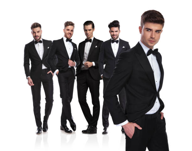 istock elegant team leader stands in front and looks to side 1038703518