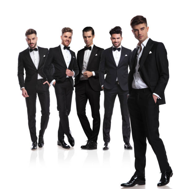 istock group of five grooms with relaxed leader standing in front 1038703636