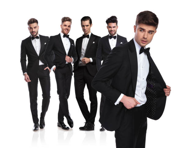 istock five handsome men in tuxedoes with leader looking to side 1038703808