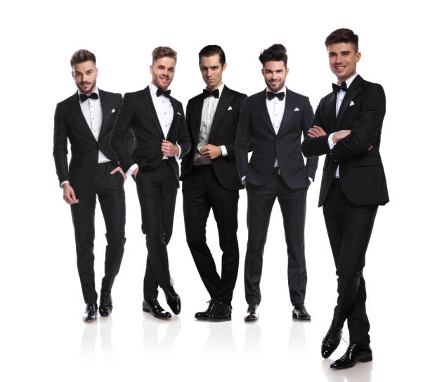 istock group leader of grooms stands in front with folded arms 1038703900