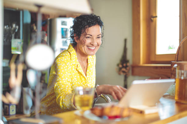 istock Mature woman is checking her finances at home 1038703956