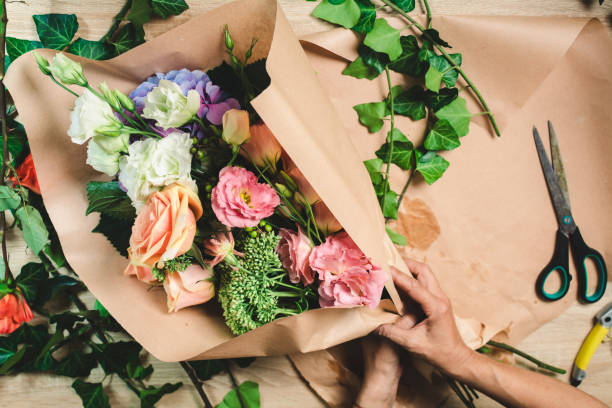 istock Female florist making flower bouquet 1038704326