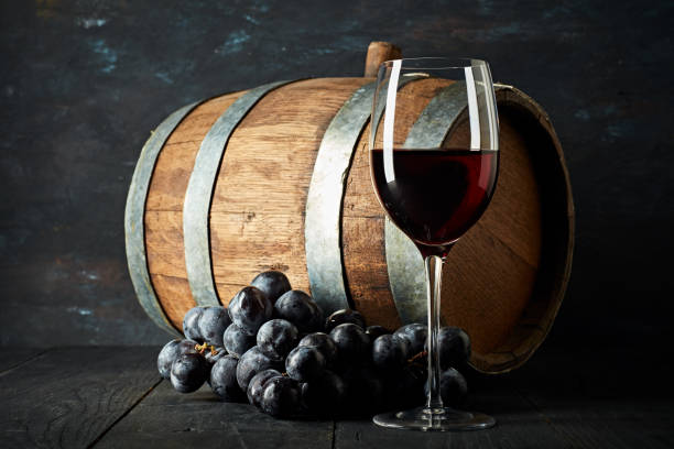istock Red wine and wooden barrel 1038708346