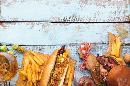 fast food on wooden background. Top View