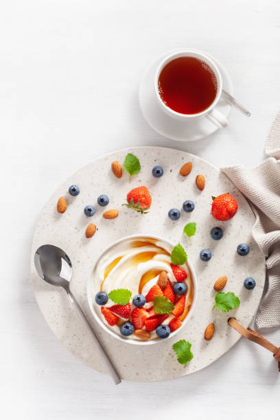 istock yogurt with strawberry blueberry honey almond for breakfast 1038718708