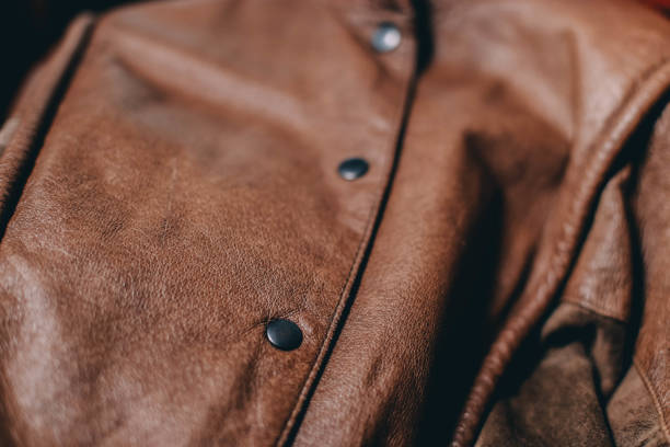 istock leather material, clothing, jacket. handmade, seams. 1038722558