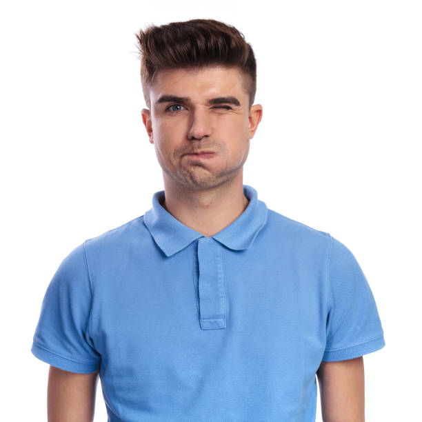 istock goofy young casual man blows his cheek  and winks 1038723412