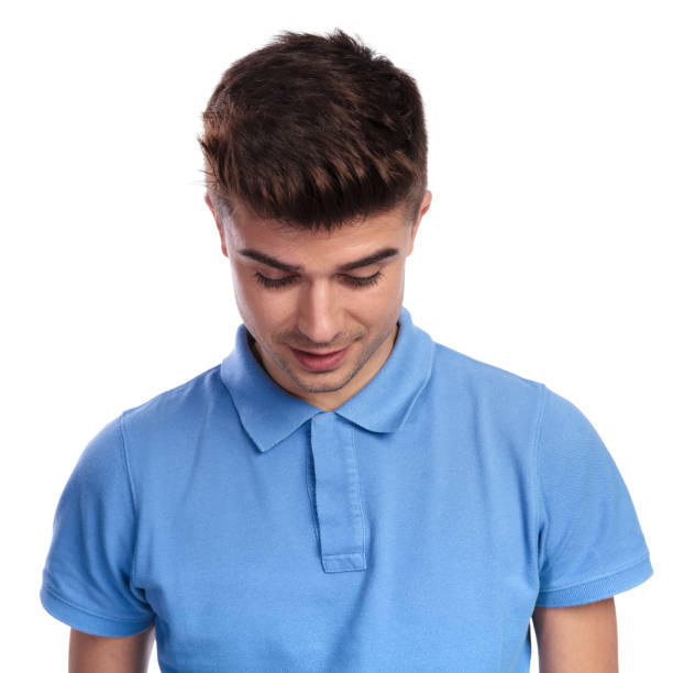 istock smiling casual man looks down 1038725926