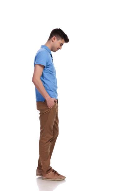 istock side view of a young casual man looking down 1038730036