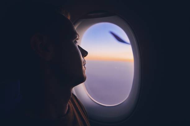 istock Man traveling by airplane 1038734216