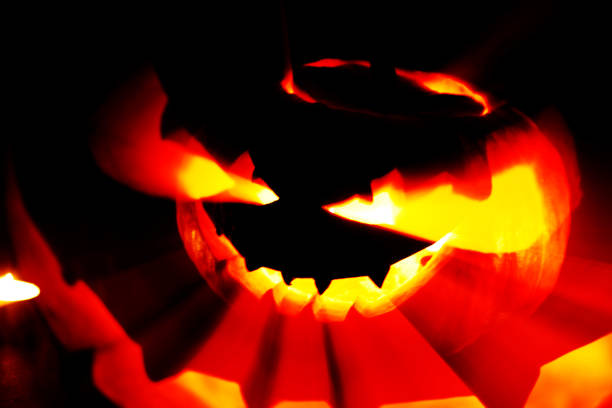 istock Jack O Lantern halloween pumpkin on black background 1038735906
