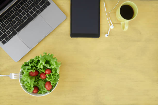 istock Overhead view of desk with various items 1038737154