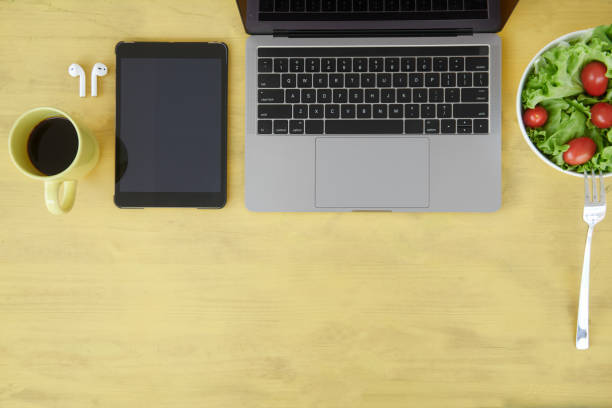 istock Overhead view of desk with various items 1038739060