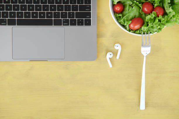 istock Overhead view of desk with various items 1038742216