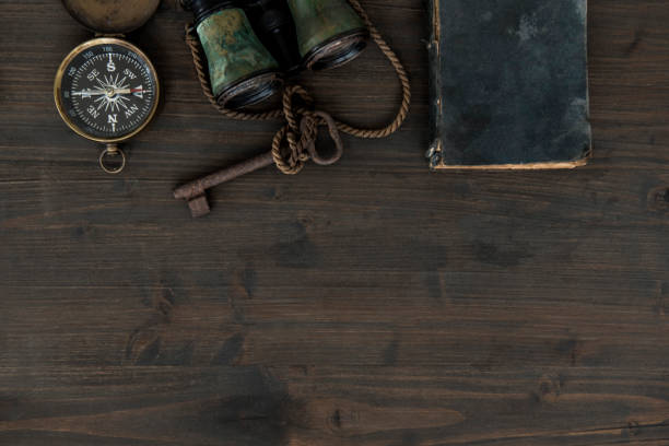 istock Overhead view of desk with old nautical items 1038744618