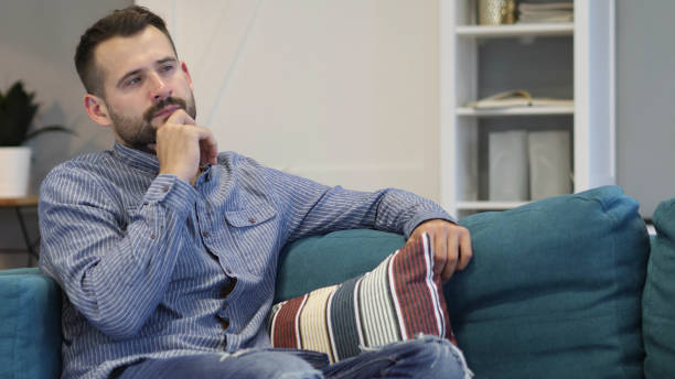istock Penisve Thinking Casually Sitting Man, Close up 1038751174