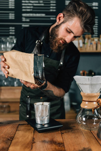 istock Barista Weighs Coffee On A Digital Scale 1038753894