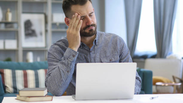 istock Headache, Man in Tension Working in Office, Pain 1038753944