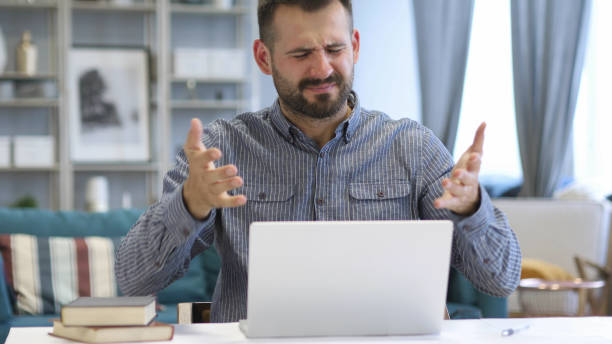 istock Loss, Frustrated Man Working on Laptop 1038754006