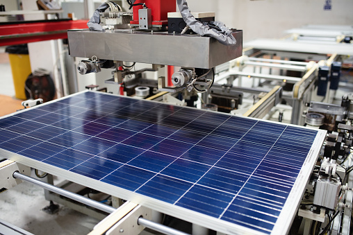 Manufacturing of solar panel system in factory.Industry concept.