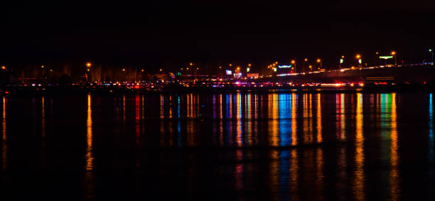 istock Blurred city lights with bokeh effect reflected on water 1038762920