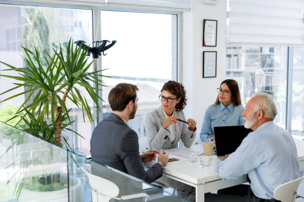 istock Business people having board meeting in modern office 1038767142