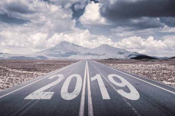 istock 2019 concept with asphalt road and beautiful cloudy sky 1038768156