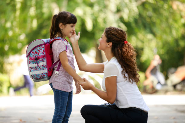istock Mother taking her daughter to school 1038768710