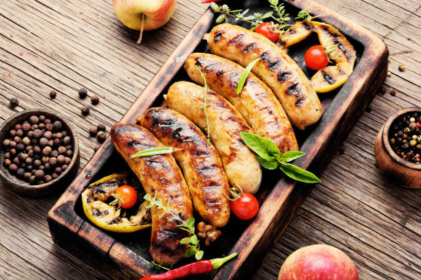 istock Grilled sausages on cutting board 1038773048