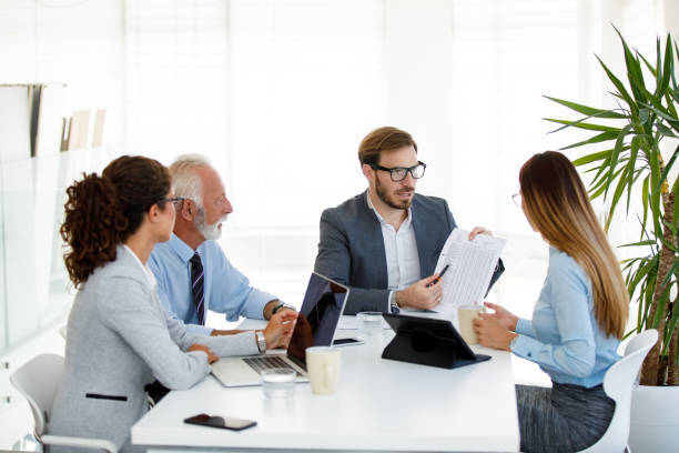 istock Partners discussing their business development in a meeting 1038774998