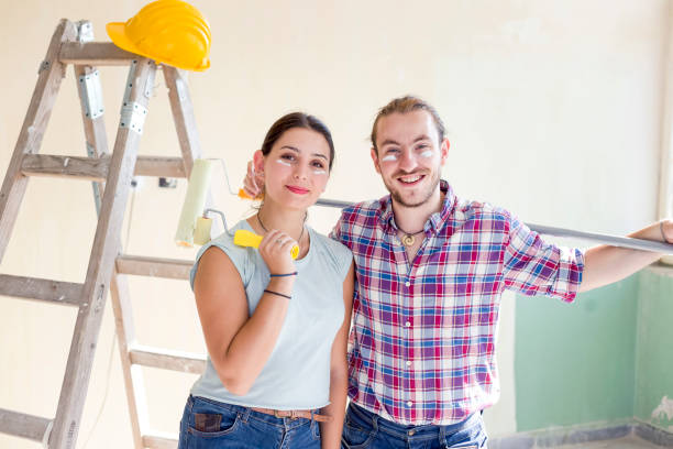 istock Beautiful young couple making redecoration at home 1038777458