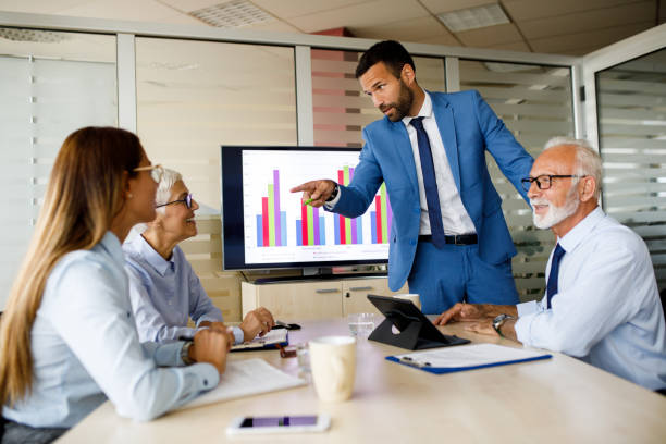 istock Group of business people during presentation 1038783268