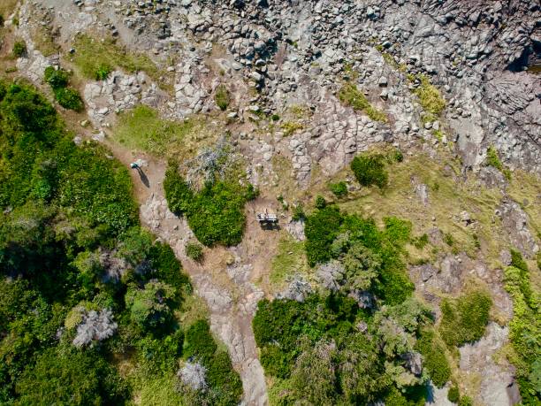 istock Sitting man on bench - forest and rocks - Areal drone shot 1038814664