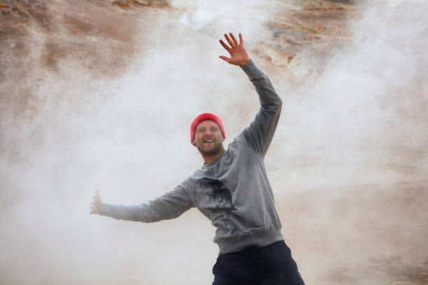 istock Open arms. Man enjoying hissing steam vents 1038815224