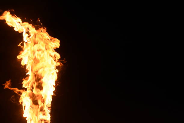 istock A pillar of fire against a black background 1038843740