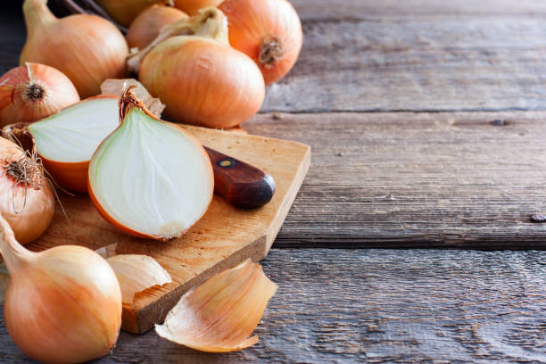 istock Cut across a bulb on a wooden board, selective focus 1038844118