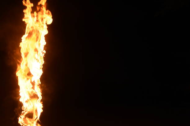 istock A pillar of fire against a black background 1038846686