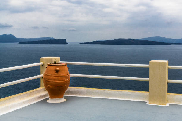 The large picturesque terrace on Santorini island offers views of the Aegean sea and the Caldera of an ancient volcano.