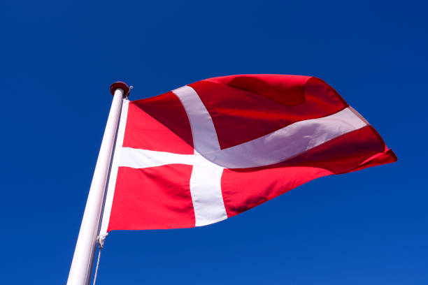 istock Denmark: Dannebrog fluttering in the wind 1038848568