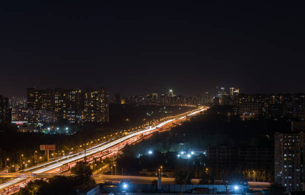 istock City night view highway and Car taillight trajectory 1038849682
