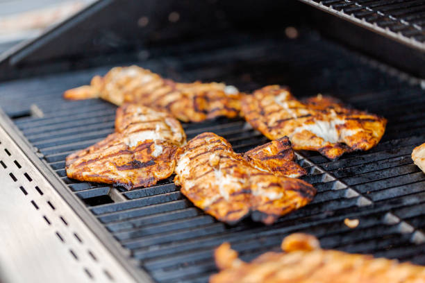 istock Grilling cod for fish tacos on outdoor gas grill. 1038851860