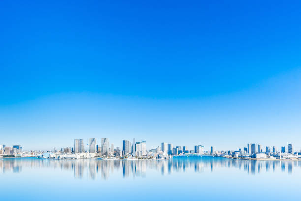 panoramic city skyline of tokyo bay in odaiba, Japan Asia Business concept for real estate and corporate construction - panoramic city skyline aerial view of tokyo bay with mirror reflection under blue sky in odaiba, Tokyo, Japan tokyo stock pictures, royalty-free photos & images