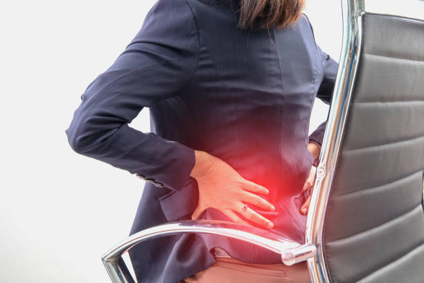 istock woman sitting on office chair and feeling back ache 1038859996