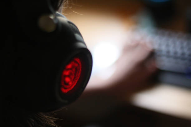 istock Teenage boy playing games on his computer at home 1038879154